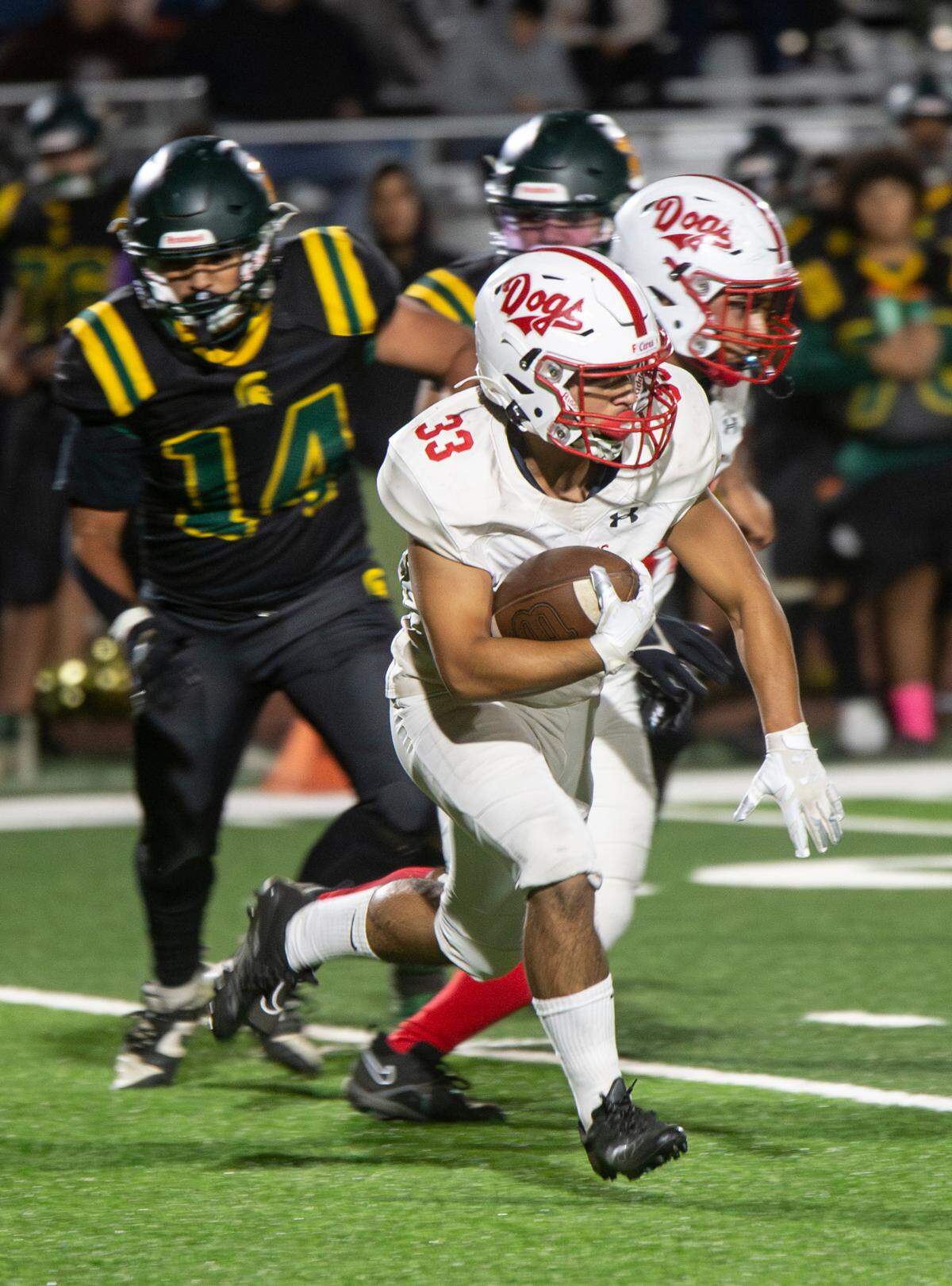 Isaac Vizcarra (33) of Ceres High works his way upfield during a WAC game against Davis High on Friday Oct. 27, 2023. 
