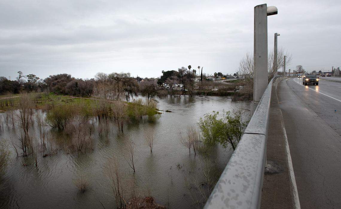 The Tuolumne River has swelled prompting an evacuation warning from the Stanislaus County Office of Emergency Services residents near the 9th Street bridge in Modesto, Calif., Thursday, March 9, 2023.