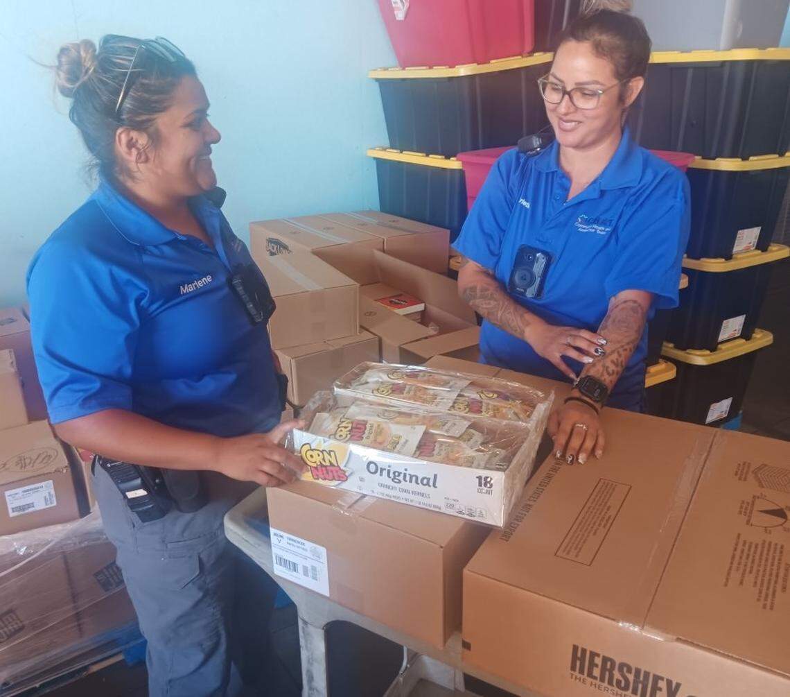 Modesto Police Department CHAT specialists Marlene Marron and Christina Hernandez pick up Hershey bars, Corn Nuts and beef jerky to hand out as part of their outreach to homeless people. The Food Initiative of Greater Stanislaus, formerly Inter-Faith Ministries of Greater Modesto, is going mobile with its food pantry to eventually have its trucks make 42 stops each month at locations across the county, including stops in Modesto, Oakdale, Turlock, Waterford and Patterson.