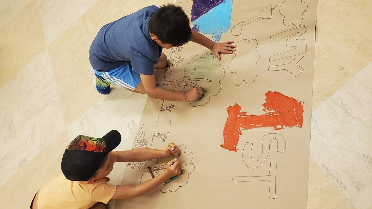 Youths busily creating during a Carnegie Arts Center 2025 summer art camp.