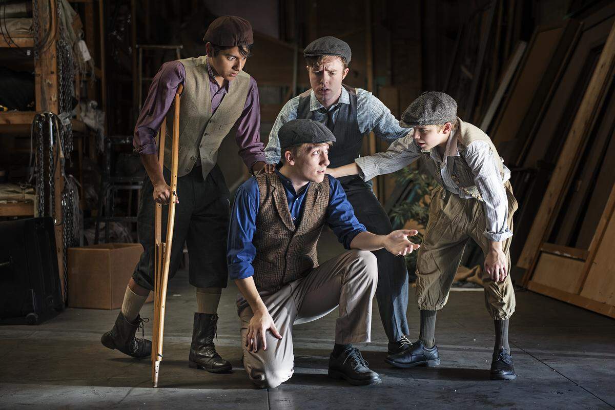 From the left, Pablo Hernandez, Jeffry Jackson and John Sylvester, and Jacob Holdaway, kneeling, are part of the cast of the Modesto Performing Arts production of Newsies. Photographed in Modesto, Calif., Wednesday, July 24, 2019.