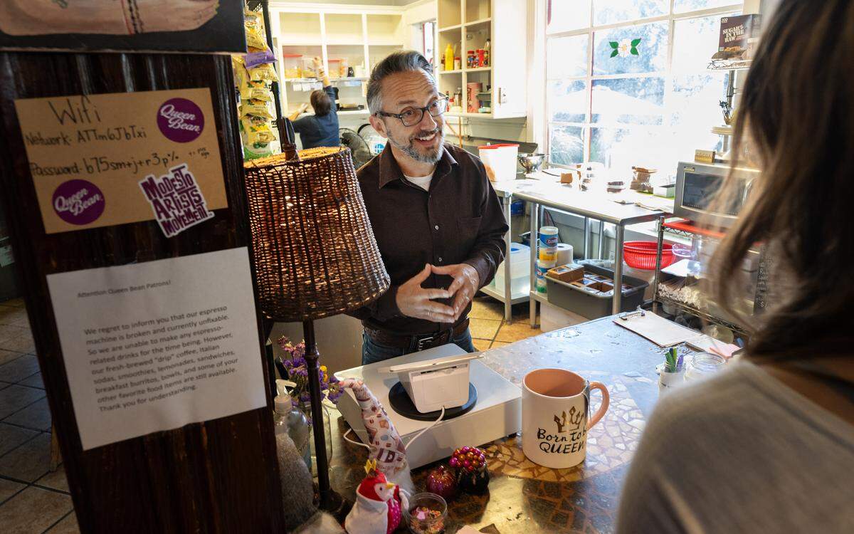 Co-owner Sam Pierstorff takes a customer’s order at Queen Bean Coffee & Social House in Modesto, Tuesday, Oct. 22, 2024.
