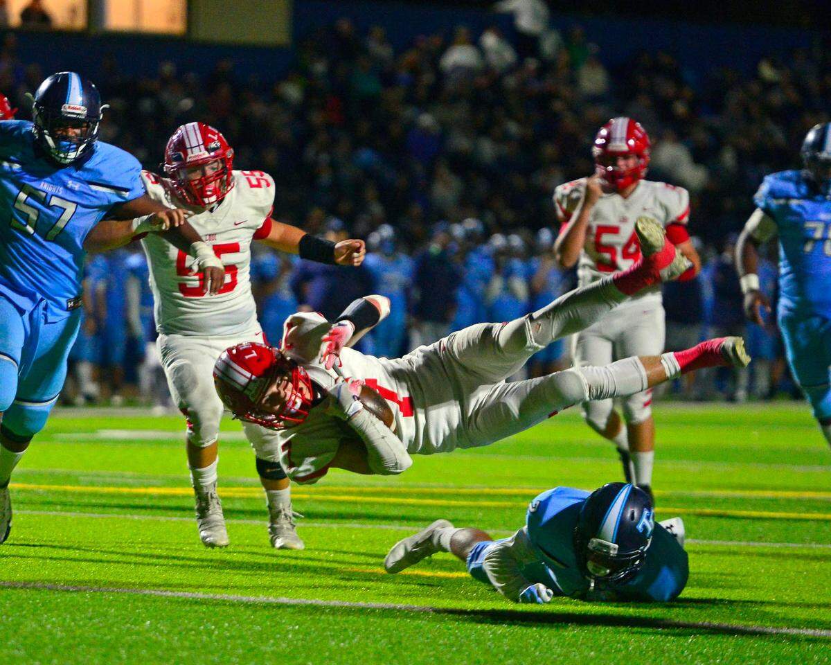 Lodi running back Brayden Stout (7) dives into the endzone for a touchdown during a 2021 CIF Sac-Joaquin Division II playoff game between Downey High School and Lodi High School at Downey High School in Modesto, California on November 5, 2021