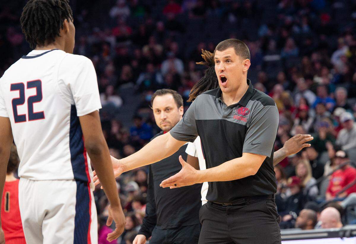 Modesto Christian coach Brice Fantazia talks with Kodey Weary during the Sac-Joaquin Section Division I championship game at Golden 1 Center in Sacramento, Calif., Saturday, Feb. 25, 2023.