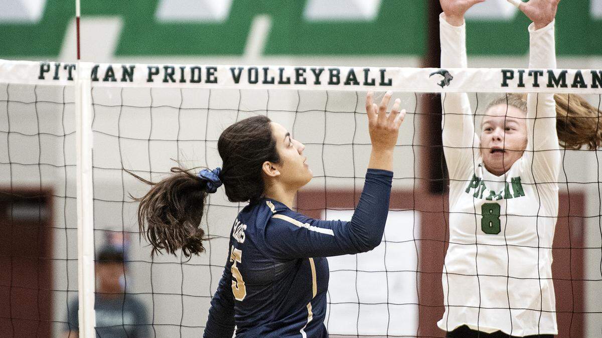 Central Catholic’s Abby Castillon floats the a return as Pitman’s McKinley King defends during the non-conference match at Pitman High School in Turlock, Calif., Thursday, Sept. 12, 2019. Central Catholic won the match 3-0.