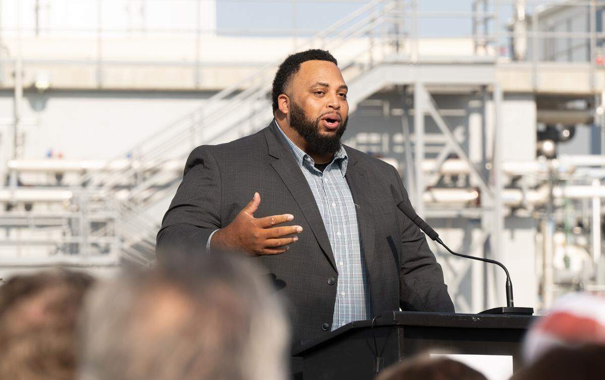 Jason Brown, owner of First Fruits Farm in North Carolina and former NFL player, speaks during a ribbon cutting ceremony at Divert Inc. in Turlock, Wednesday, Dec. 4, 2024. The Divert facility converts unsold food into fuel and fertilizer.
