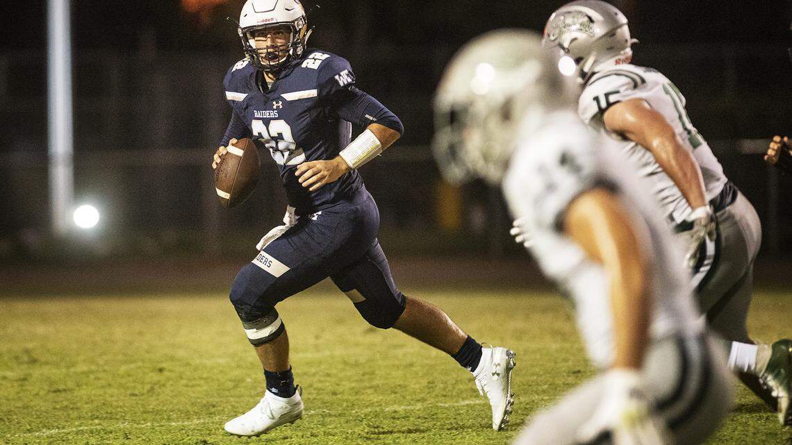 Central Catholic’s Dalton Durossette rolls out to pass during the non-league game with De La Salle at Central Catholic High School in Modesto, Calif., Aug. 30, 2019.