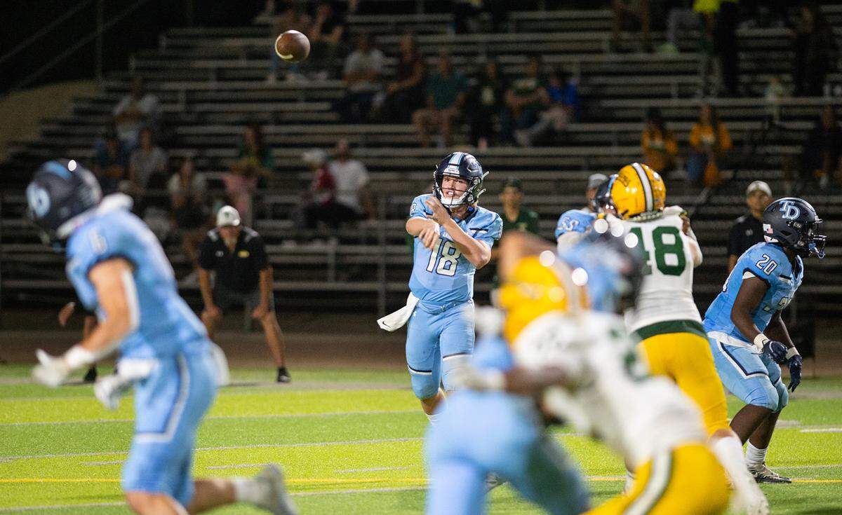 Downey quarterback Conner Stoddard throws the ball during the nonleague game with Tracy at Downey High School in Modesto, Calif., on Friday, September 16, 2022.