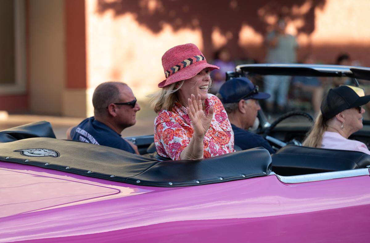 Candy Clark, star of George Lucas’ film “American Graffiti”, waves to spectators during the classic car parade in Modesto, Calif., on Friday, June 10, 2022.