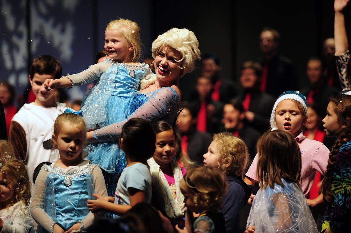 Lindsay Pearce is pictured with children Friday evening (11-21-14) during Frozen- A Family Holiday Choral Concert at Modesto Junior College in Modesto, CA.