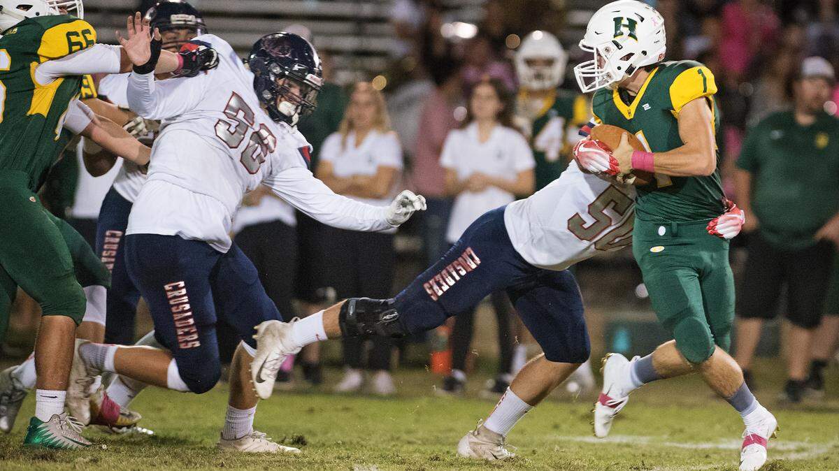 Modesto Christian’s Dominic Myers tracks down Hilmar’s Ryan Teixeira during the Trans Valley League game at Hilmar High School in Hilmar, Calif., on Friday, Oct. 12, 2018. Modesto Christian won the game 24-21.