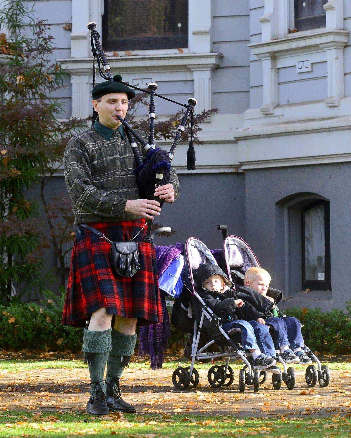 Jason Hoffman plays the bagpipes during the Dickens Faire in Downtown Modesto on December 1, 2018. 
