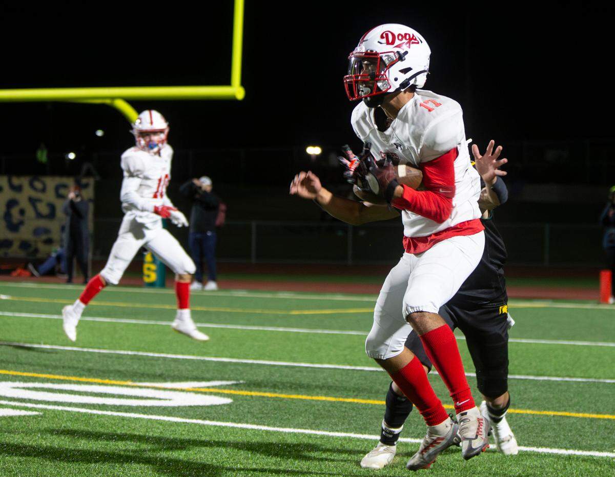 Ceres High’s Manuel Mendoza, 17, catches a first-down pass during a WAC game against Davis High on Friday Oct. 27, 2023.