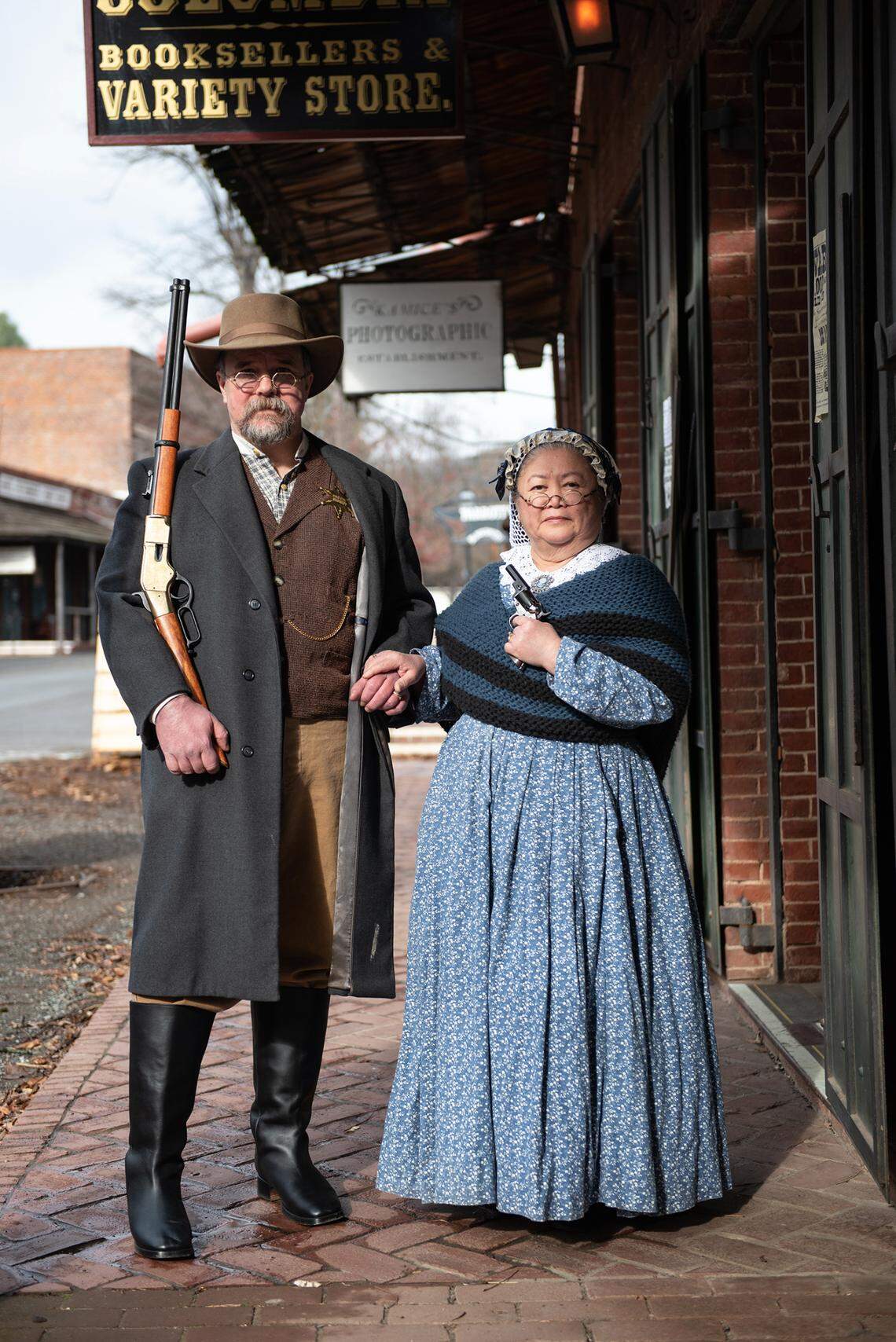 Columbia Booksellers and Variety Store owners Michael and Rosanna Sharps outside their store in Columbia, Calif., on Friday, Jan. 22, 2021. The Columbia State Historic Park shop was forced to close after its point-of-sale account was canceled by San Francisco tech service Square over replica guns.