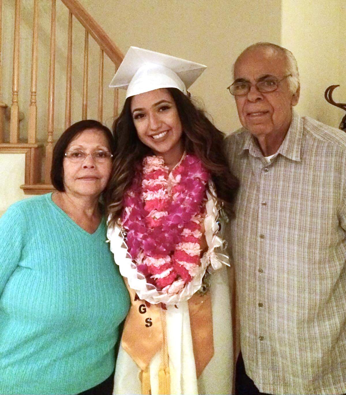 Anaissa Medina with her grandparents William and Juanita Huerta.