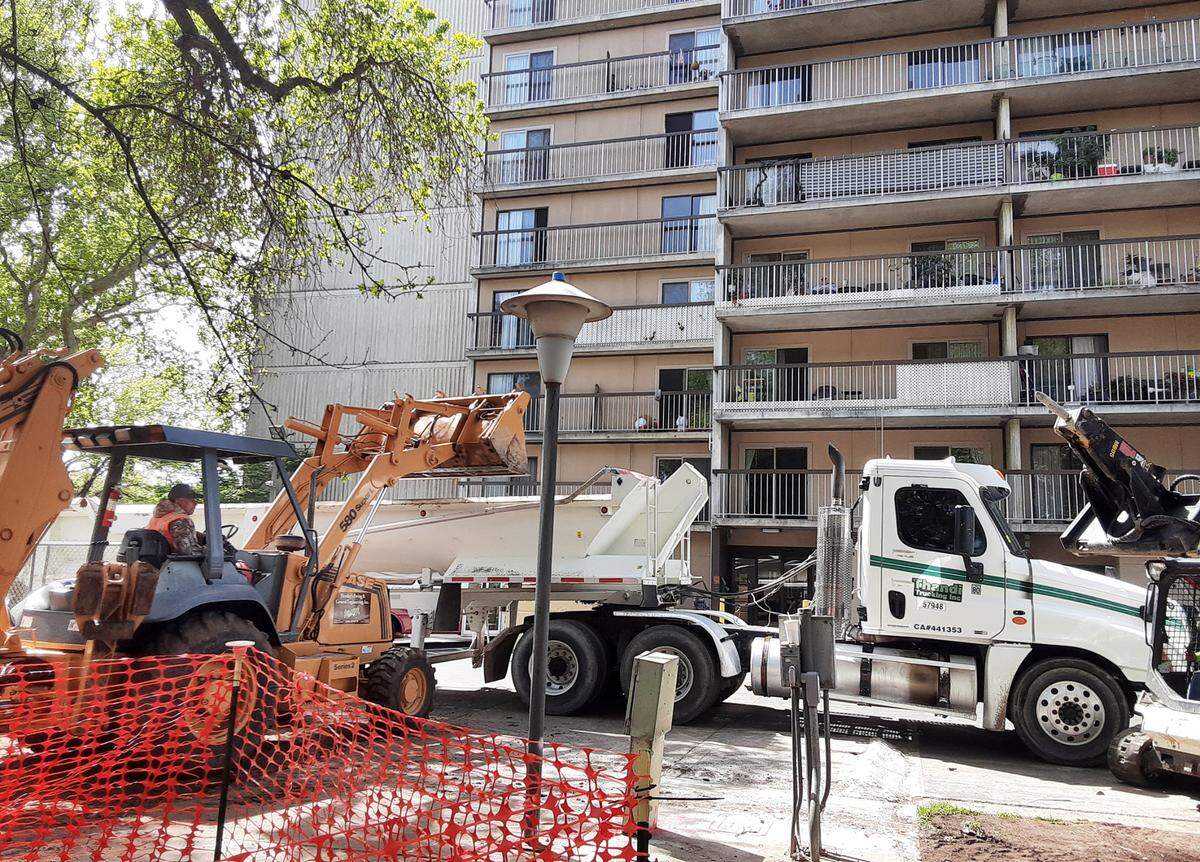 Workers were completing the demolition work Thursday, March 31, 2022, in Modesto’s Ralston Tower Park. It’s the first step in a $1.2 million makeover of the tiny park next to Ralston Tower, the low-income senior complex in downtown.