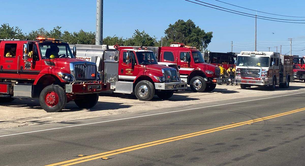 Fire crews from both Stanislaus and San Joaquin counties, assisted by Cal Fire and other agencies, battle a vegetation fire on both sides of McHenry Avenue near the Stanislaus River on Monday, July 3, 2023.