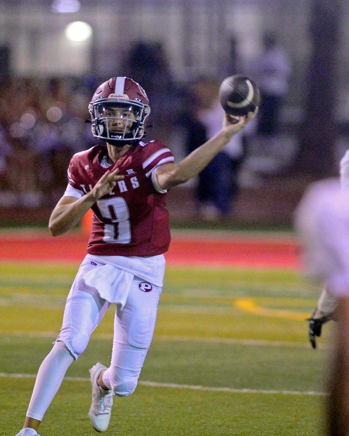 Patterson quarterback Max Medina (3) throws a pass over the middle during a game between Patterson High School and Merced High School at Patterson High Aug. 23, 2024.