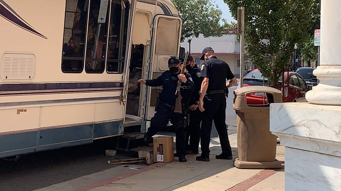 Police detain armed man, find boy, after RV driven erratically stops in downtown Oakdale