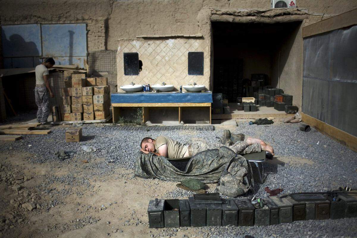 U.S. Army Pfc. Eli Price, of Modesto California,  from the 101st Airborne Division sleeps at COP Nolen, in the volatile Arghandab Valley, Kandahar, Afghanistan, Monday, July 26, 2010. 