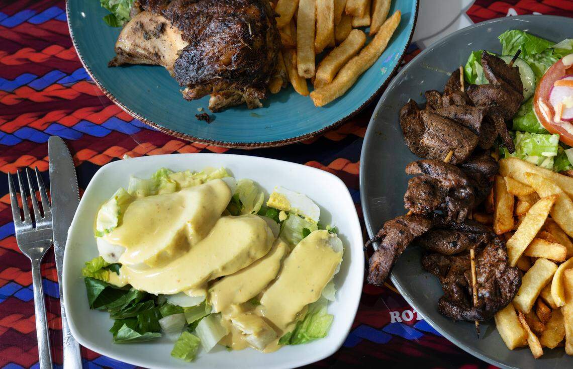 Peruvian dishes, papa a la huancaina (potatoes with cheese and hard boiled egg), bottom, rotisserie chicken, top, and an anticuchos plate (grilled beef heart), right, at Al Carbon restaurant on Coffee Road in Modesto, Tuesday, Nov. 5, 2024.