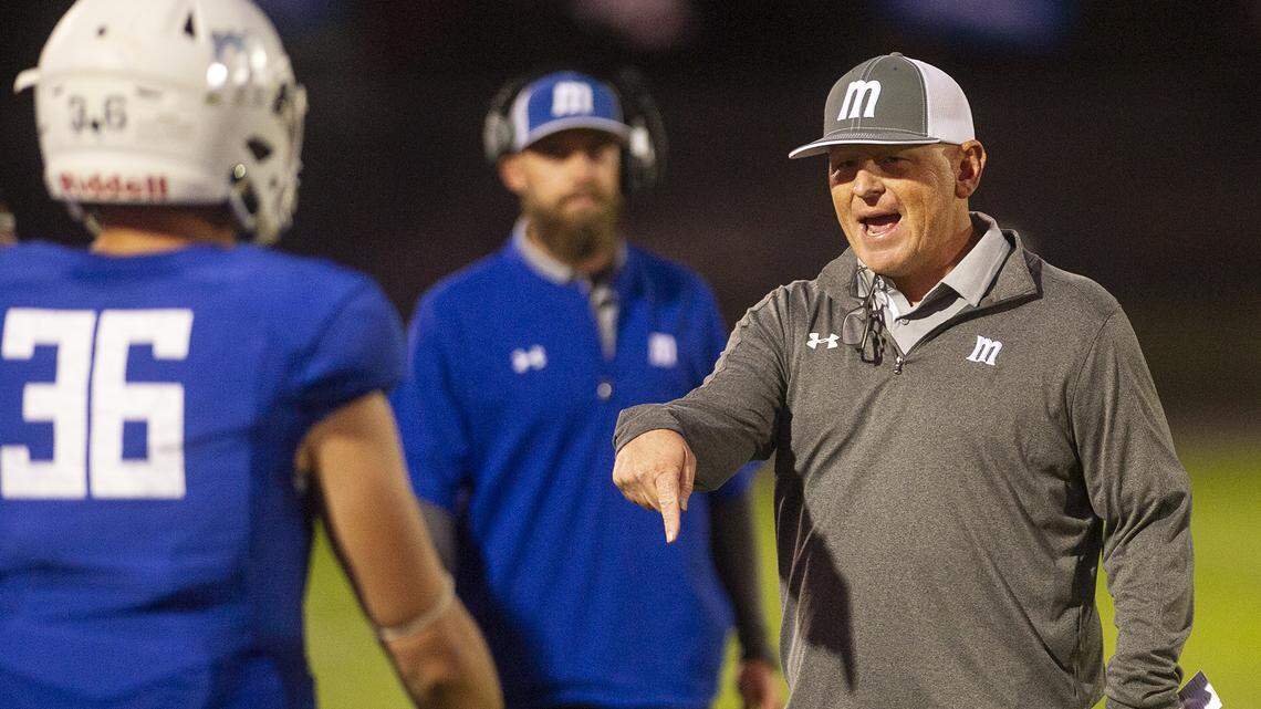Modesto Head Coach Rusty Stivers talks with Tristian Deshields during theValley League game with College of the Sequoias at Modesto Junior College in Modesto, Calif., Saturday, Oct. 19, 2019.
