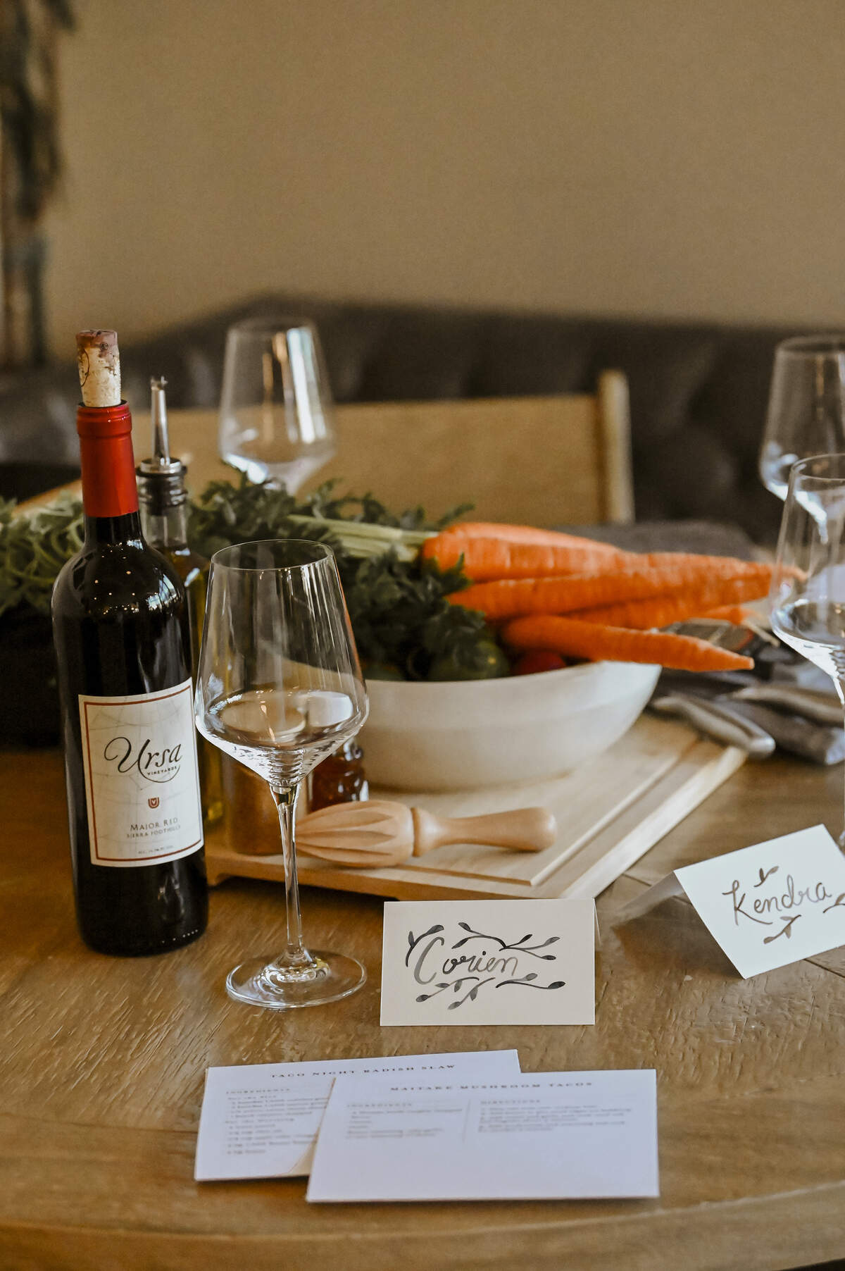 Upon entering The Dinner Party Experience venue, attendees can find their seat by searching for a place card with their name.