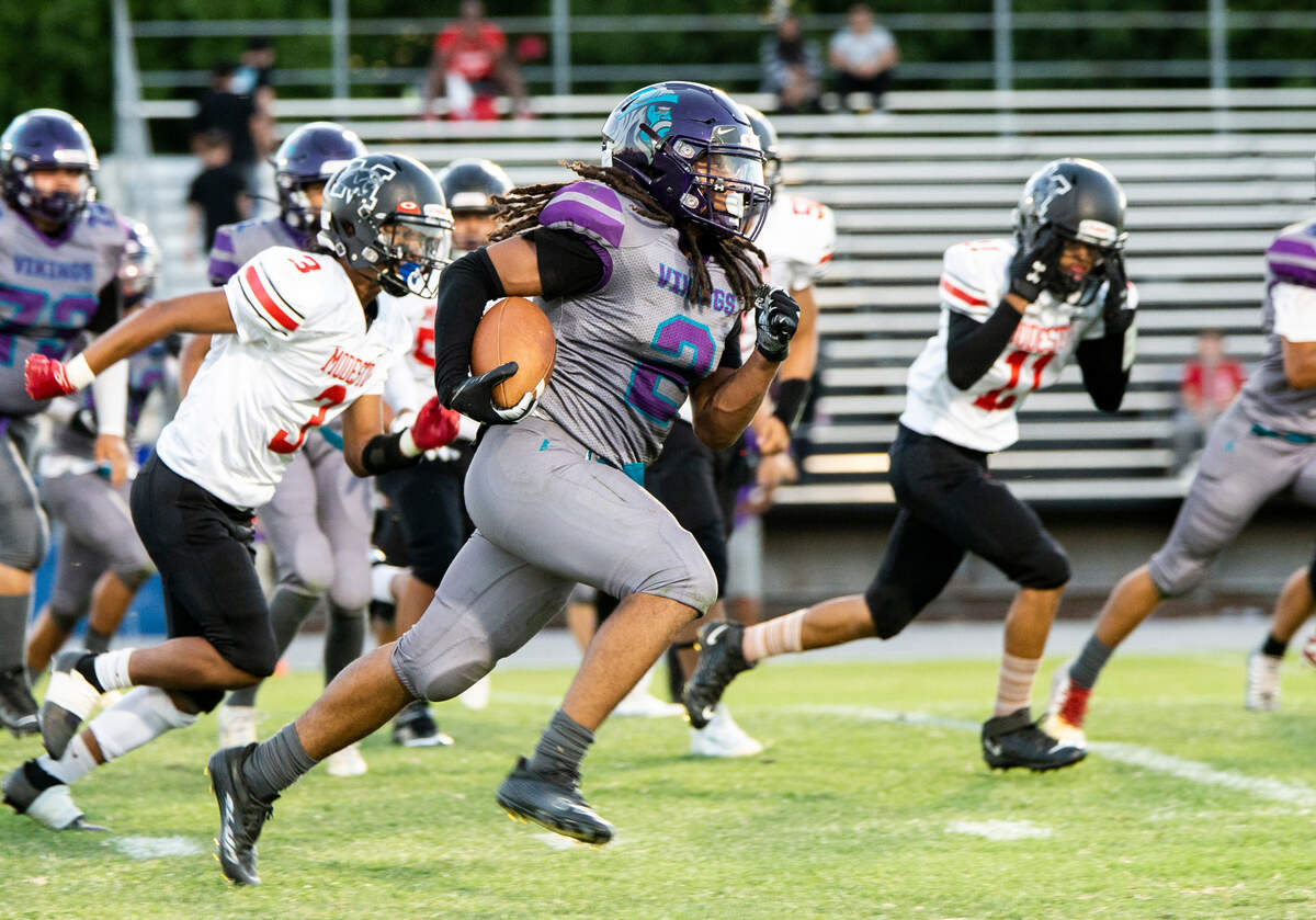 Joseph Montez, 2, of Johansen High works his way up field for a gain during Friday August 19, 2022 gain against Modesto High.