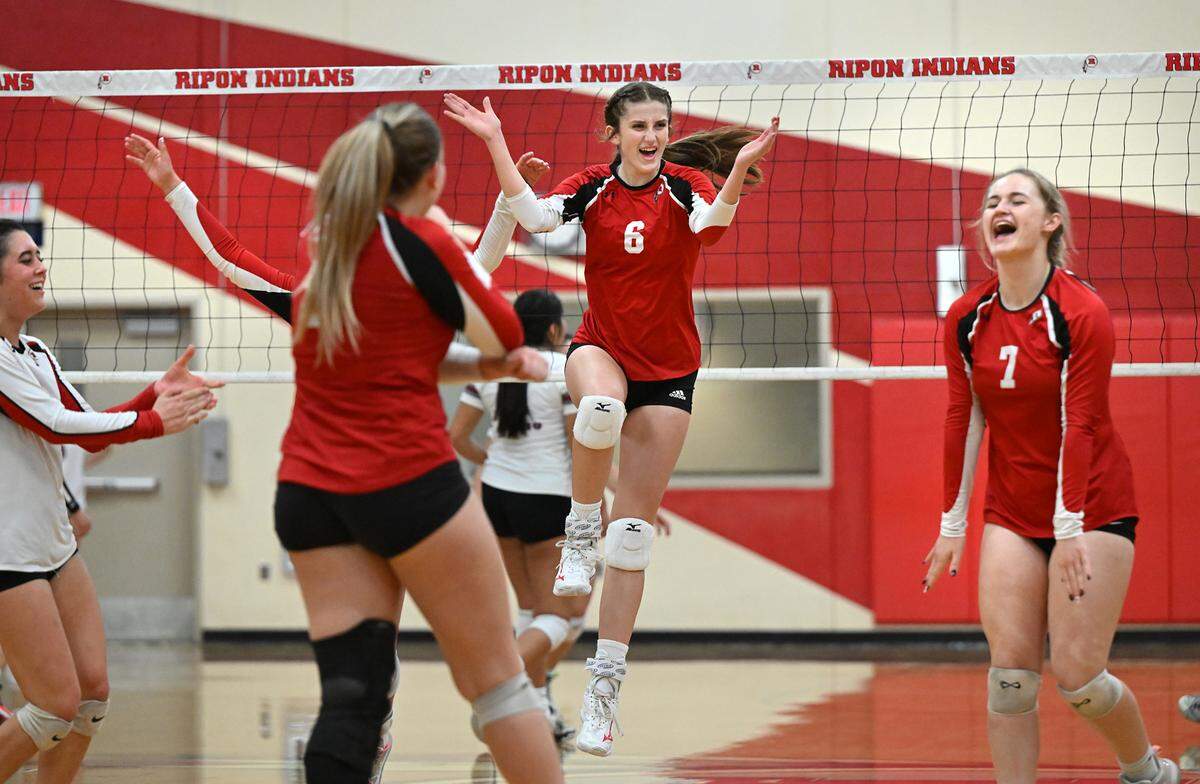 Ripon’s Olivia Neuman (6) and Kaya Whittaker (7) react to winning a point during the Division IV semifinal playoff match with West Campus at Ripon High School in Ripon, Calif., Tuesday, Oct. 31, 2023.