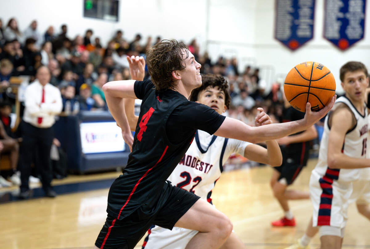 Buchanan’s Conner Sheets drives to the basket during the Holiday Hoop Classic championship game with Modesto Christian at Modesto Christian High School in Salida, Monday, Dec. 30, 2024.