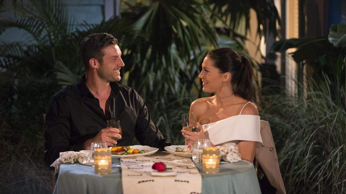 Bachelorette Becca Kufrin and Manteca native Garrett Yrigoyen share dinner in the Bahamas on an episode of "The Bachelorette" that aired July 9 on ABC.