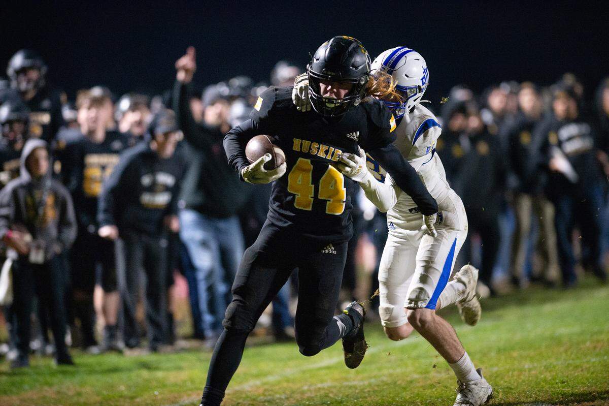 Hughson’s Liam Bridgford runs the ball during the CIF Division 5-AA Northern California Regional Bowl Game with Ripon Christian on Friday, Dec. 2, 2022, in Hughson, Calif. Hughson won 31-28.