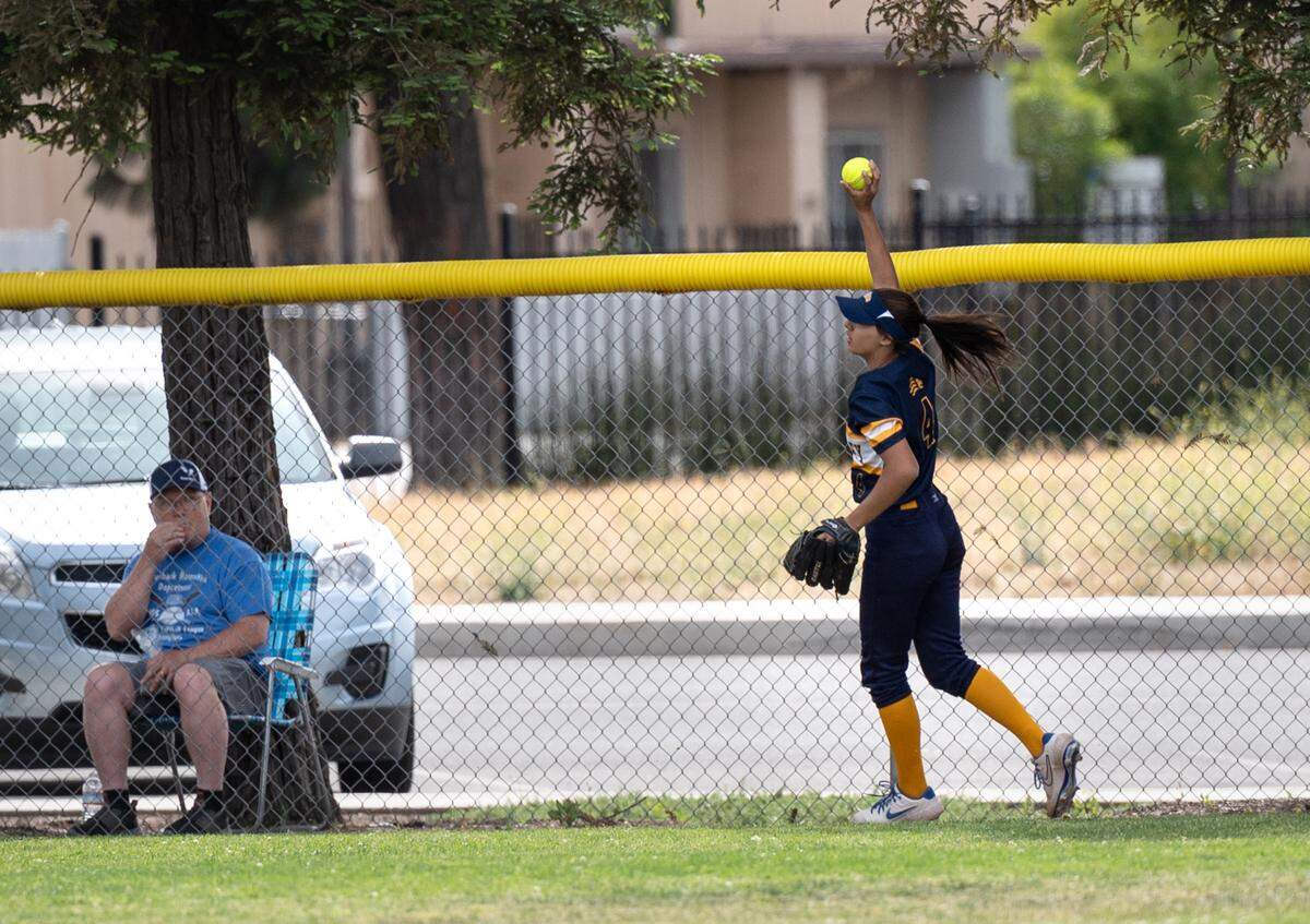 Big Valley left fielder Anni Boren shows the ball after making a catch at the outfield fence during the CIF NorCal Softball Championship game with Los Altos at Big Valley Christian High School in Modesto, Calif., on Saturday, June 4, 2022. Big Valley won the NorCal title 5-3.