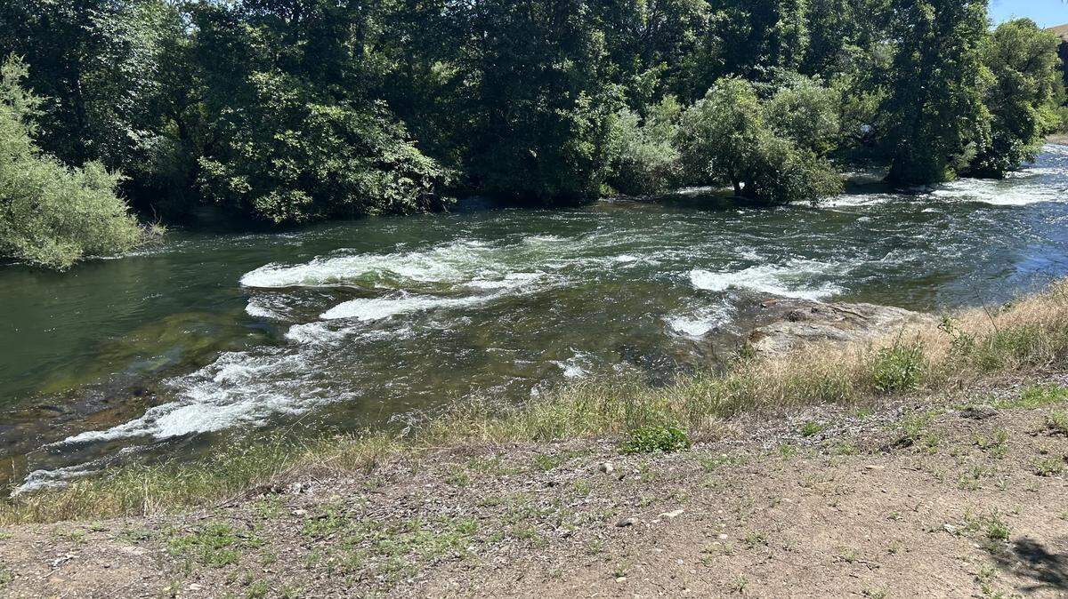 The Stanislaus River flows near Horseshoe Bend in the Oakdale area on Wednesday, May 13, 2026. Modesto Fire crews rescued six people from the fast-moving water during two separate emergencies.