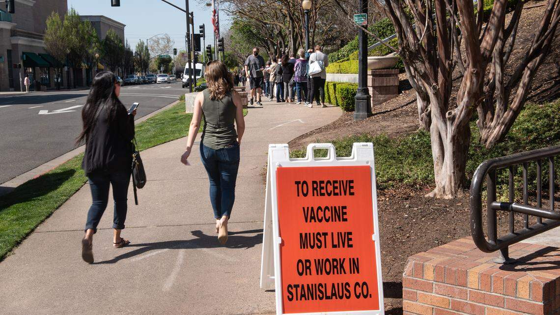 People line up at the COVID-19 vaccination clinic at Modesto Centre Plaza in Modesto, Calif., on Thursday, April 1, 2021.