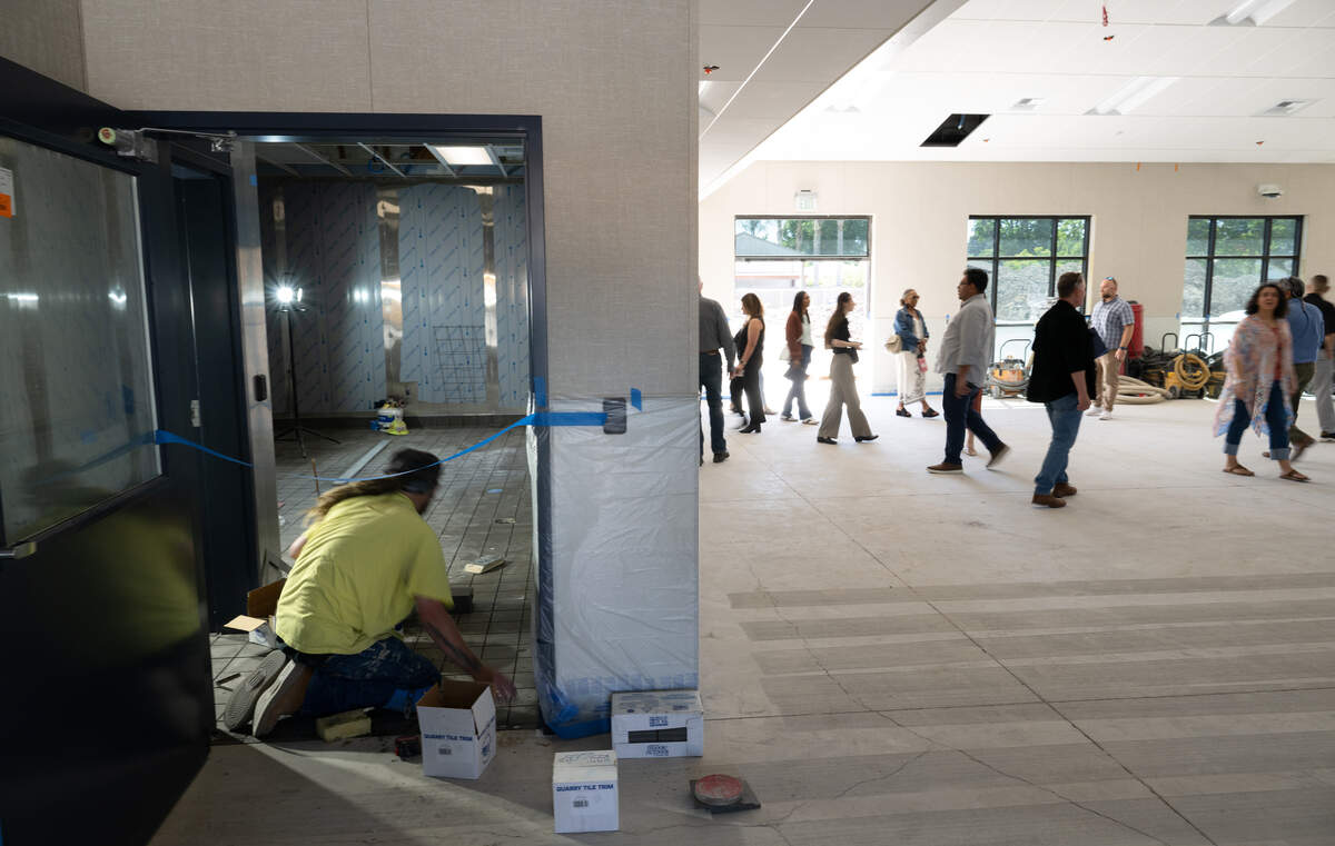 Guests walk through the multipurpose room at Elliot Alternative Education Center during the Modesto City Schools facilities tour in Modesto, Monday, Aug. 4, 2025.