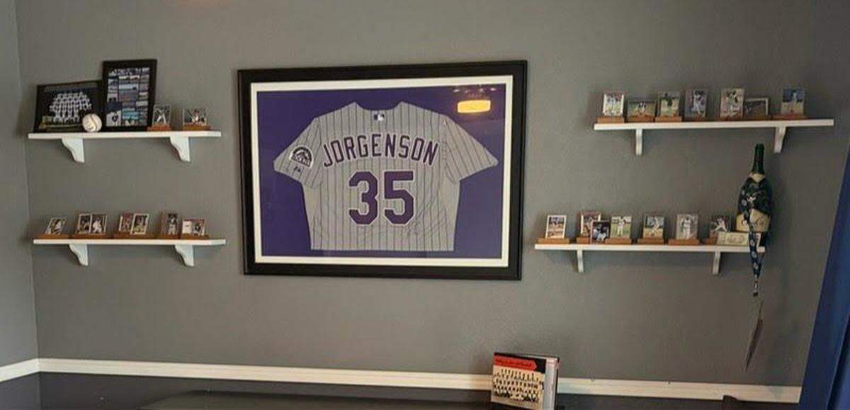 Nancy Day’s guest room is decorated with baseball cards of each player she has hosted.
