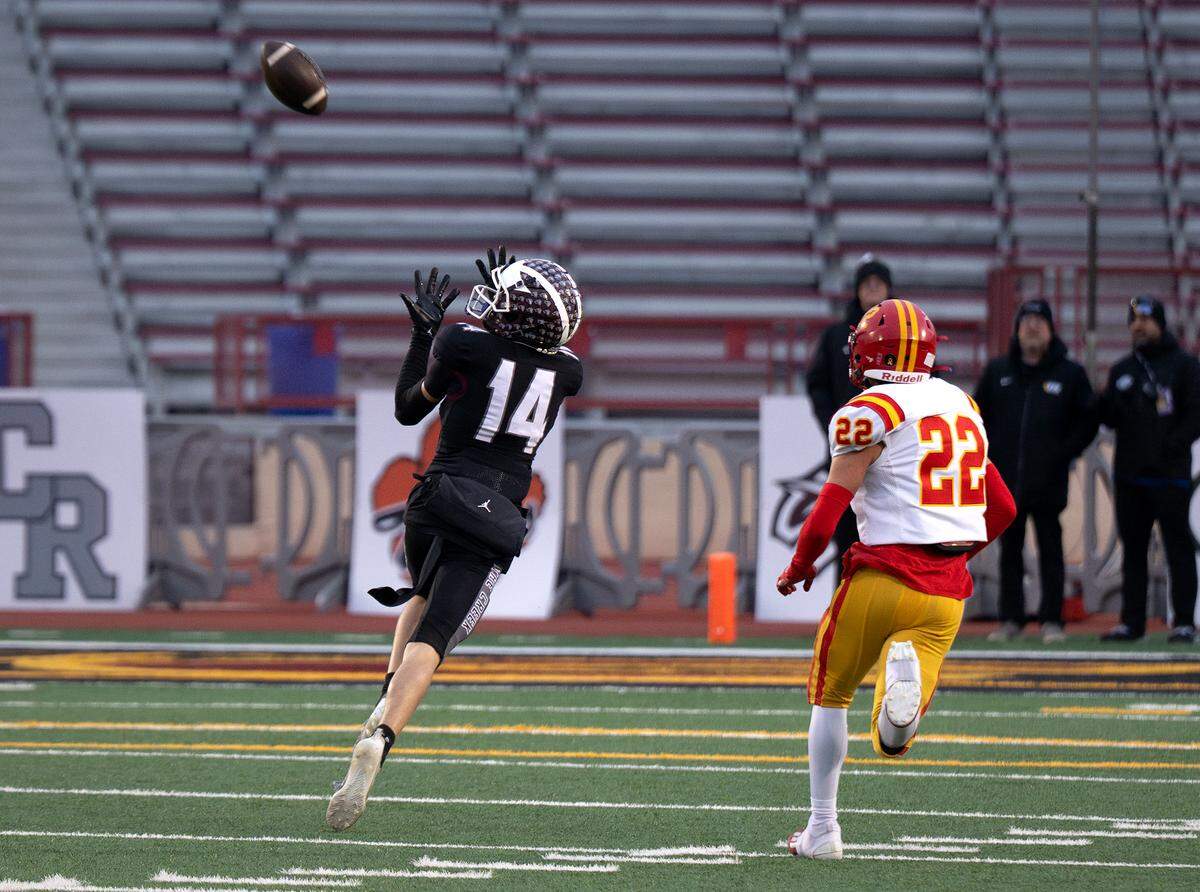 Woodcreek receiver Ethan Keim makes a touchdown catch during the CIF Sac-Joaquin Section Division III championship football game against Oakdale at Hughes Stadium in Sacramento on Friday.