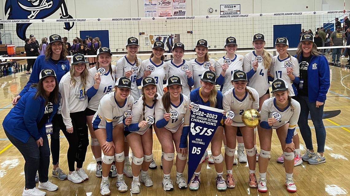 Ripon Christian players and coaches celebrate winning the Sac-Joaquin Section Division V volleyball championship at Modesto Junior College on Saturday, Nov. 5, 2022. The Knights defeated Bret Harte, 3-0.