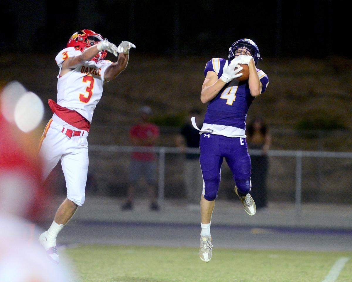 Escalon receiver Dylan Ball (4) leaps to make a catch deep down the field during a game between Escalon High School and Oakdale High School in Escalon, Calif. on Sept. 6, 2024. Oakdale won the game 21-20 in overtime.