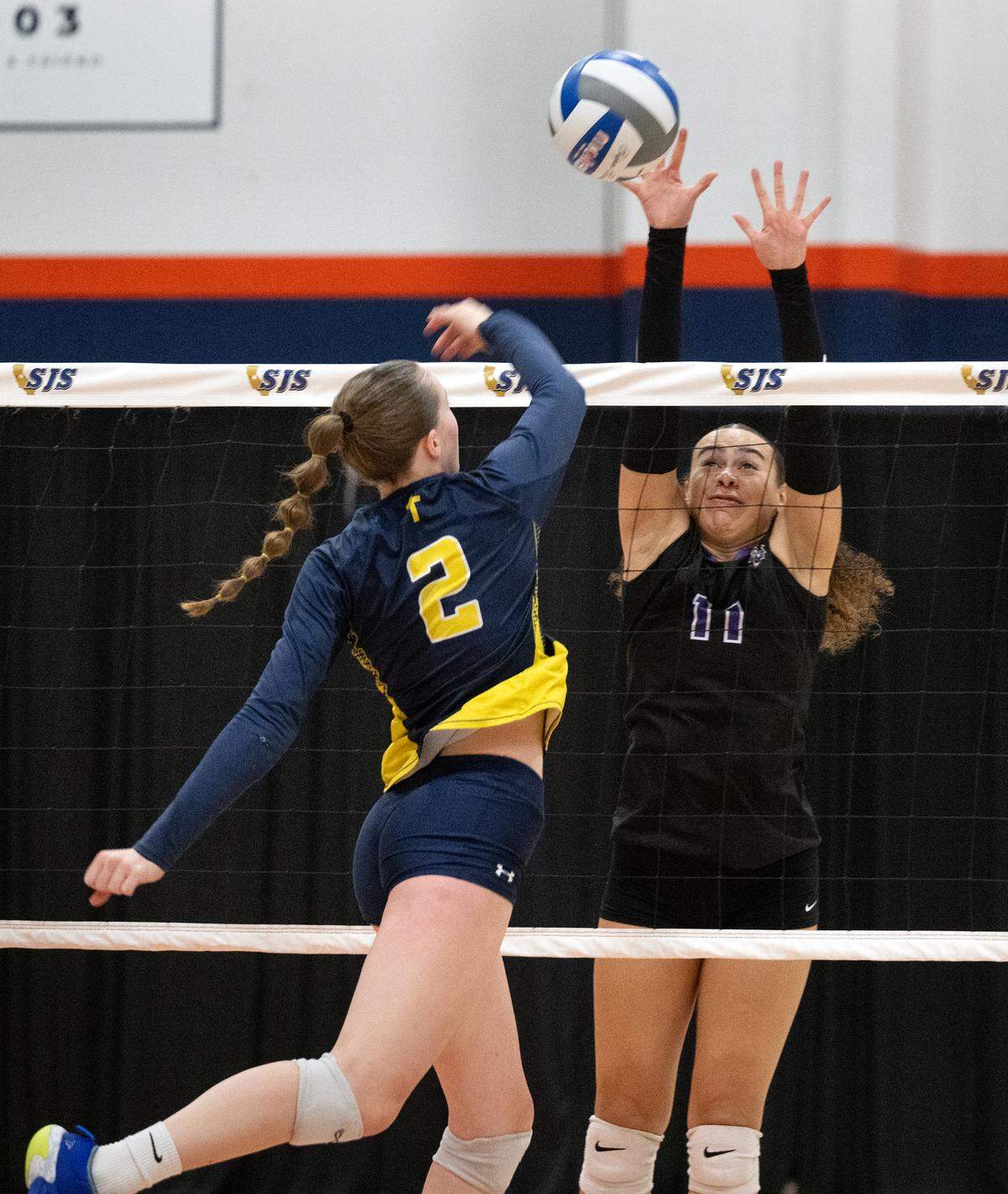 Big Valley Christian’s Jordan Beers and Bradshaw Christian’s Chloe Lester battle at the net during the Sac-Joaquin Section Division 5 championship match at Cosumnes River College in Sacramento, Saturday, Nov. 9, 2024.