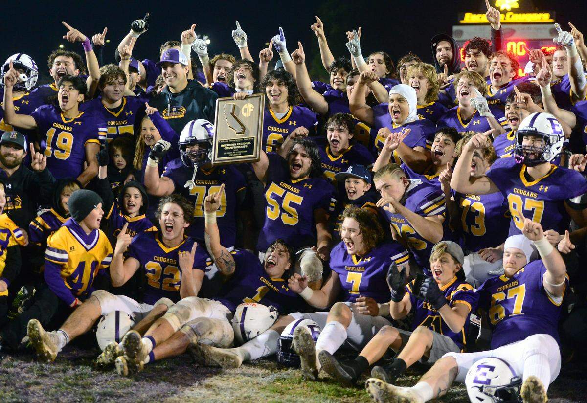 The Escalon High School team celebrates the victory in the 2022 CIF NorCal Division 4-AA Bowl Game between Escalon High School and Pleasant Valley High School at Escalon High School in Escalon CA on Dec. 2, 2022. Escalon won the game 42-20.