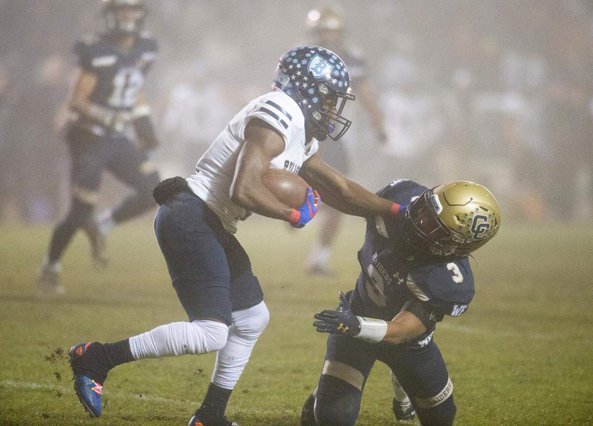 Bullard’s Jalyn Utendahl runs the ball during the CIF Division II Northern California Regional Championship game with Central Catholic at Central Catholic High School in Modesto, Calif., Dec. 3, 2021.