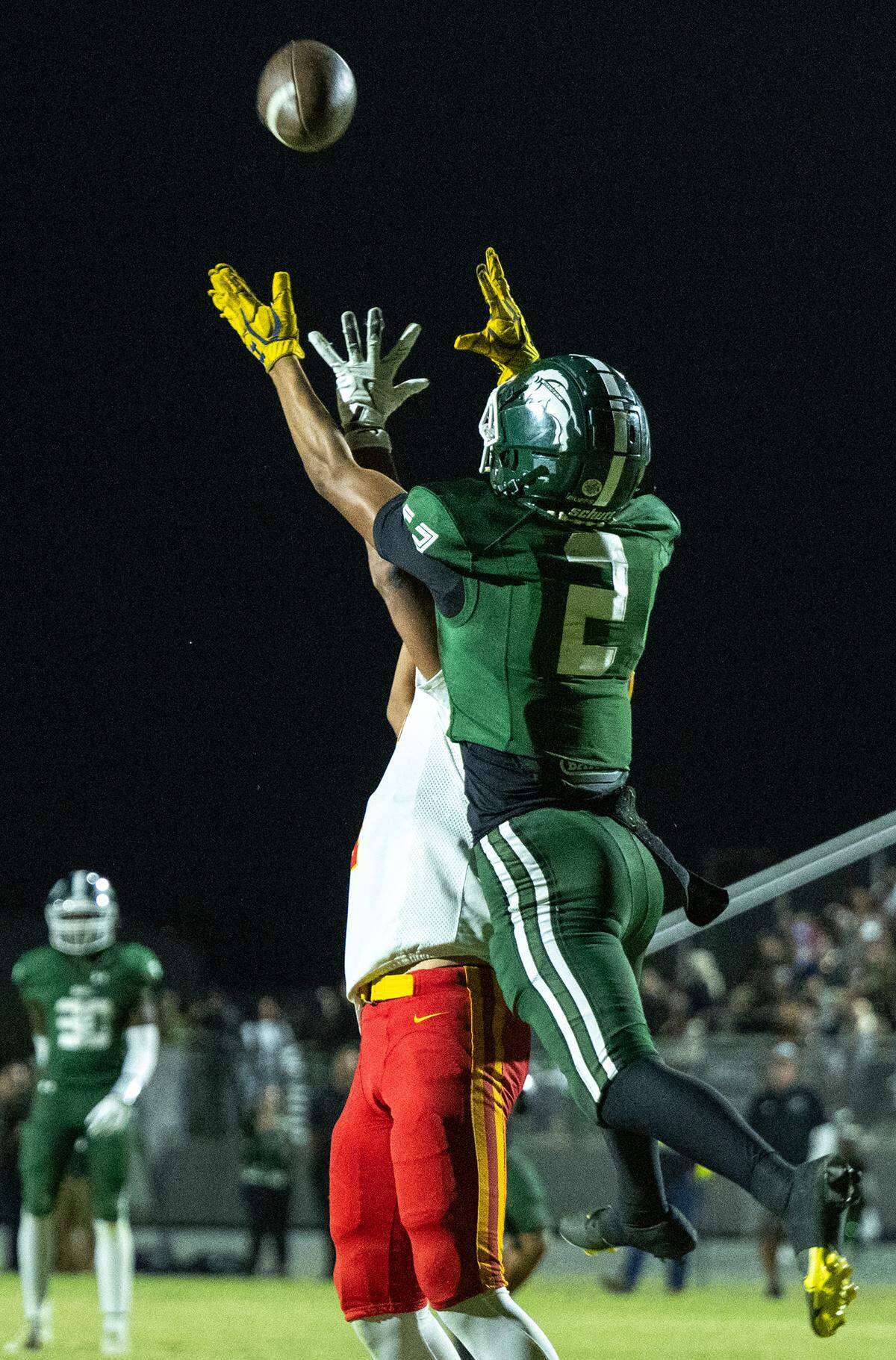 Manteca’s Quinn Martinez breaks up a pass during the Valley Oak League game with Oakdale at Manteca High School in Manteca, Friday, Nov. 1, 2024.