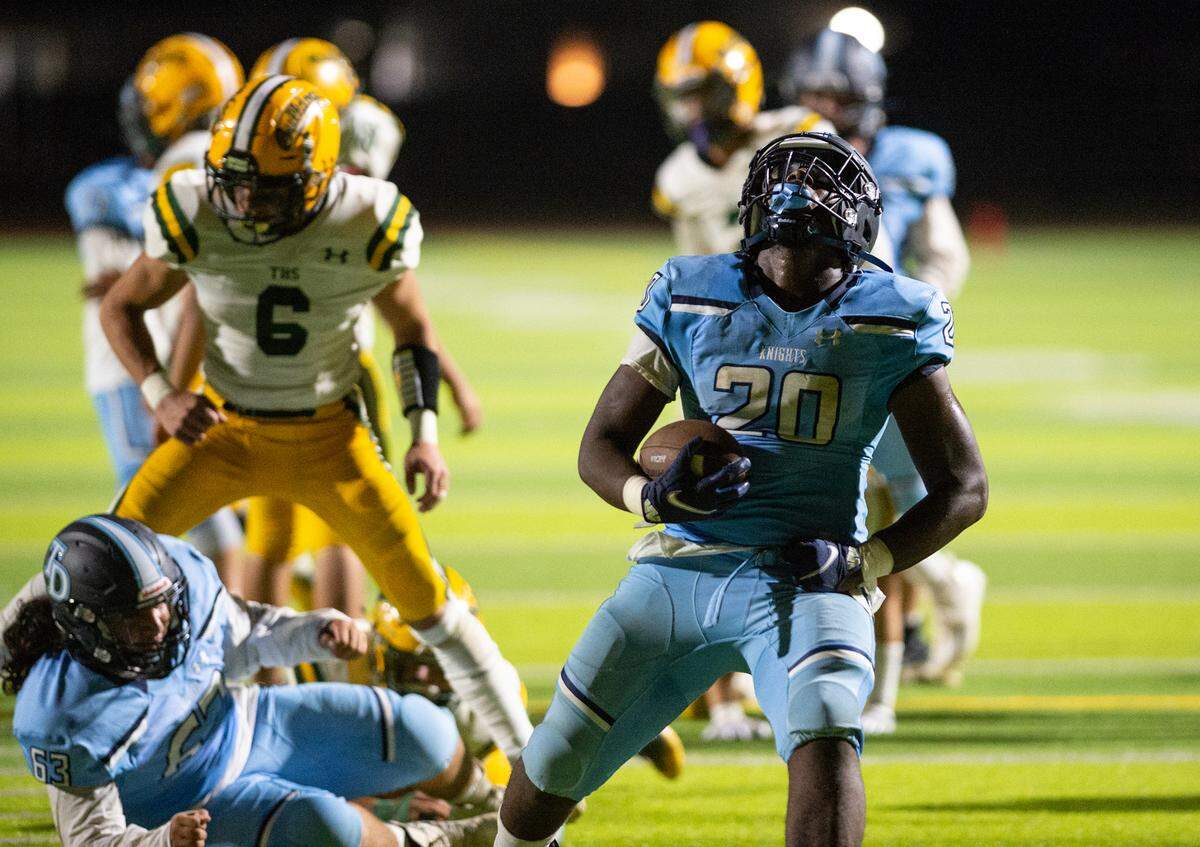 Downey’s Ki Ragland celebrates a touchdown run during the nonleague game with Tracy at Downey High School in Modesto, Calif., on Friday, September 16, 2022. Ragland had two rushing touchdowns in Downey’s 24-13 victory.