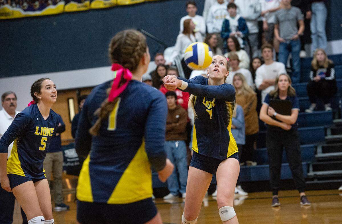 Big Valley Christian’s Trinity Beers returns a server during the division 5 CIF Northern California Regional volleyball playoff match with Minarets High School at Big Valley Christian High School in Modesto, Calif., Tuesday, Nov. 8, 2022.