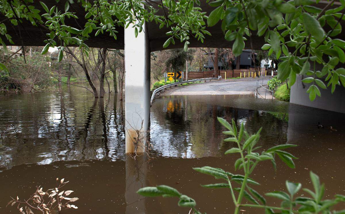 North Morton Boulevard in flooded by Dry Creek in Modesto, Calif., Tuesday, March 21, 2023.