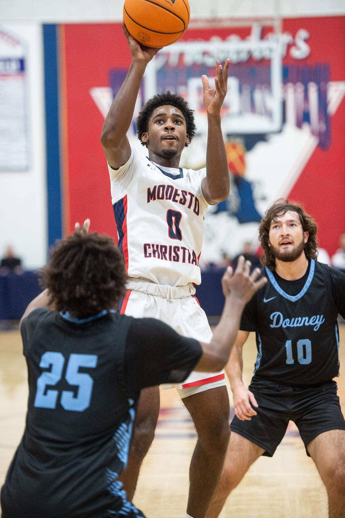 Modesto Christian’s Jalen Brown scores on a jump shot during the first round game with Downey in the Modesto Christian Holiday Hoop Classic in Salida, Calif., Tuesday, Dec. 27, 2022. MC won the game 44-37.