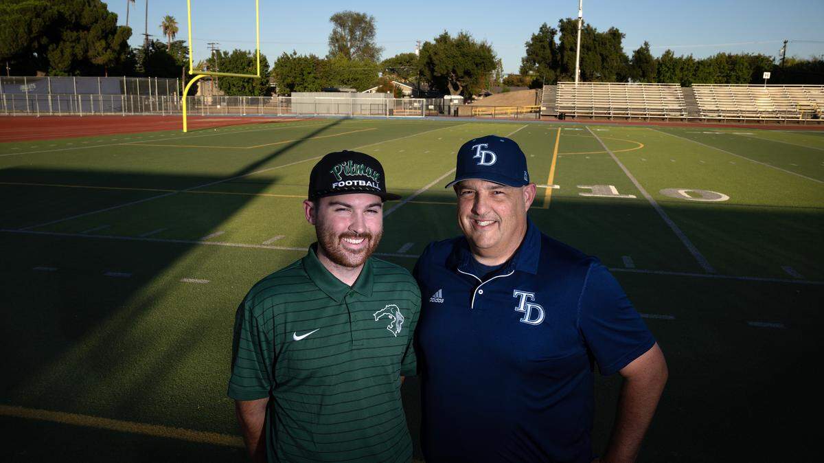Father and son head coaches Jeremy Plaa (Downey), right, and Braden Plaa (Pitman) at Downey High School in Modesto, Tuesday, Oct. 7, 2025. The coaches face off Friday for the first time.