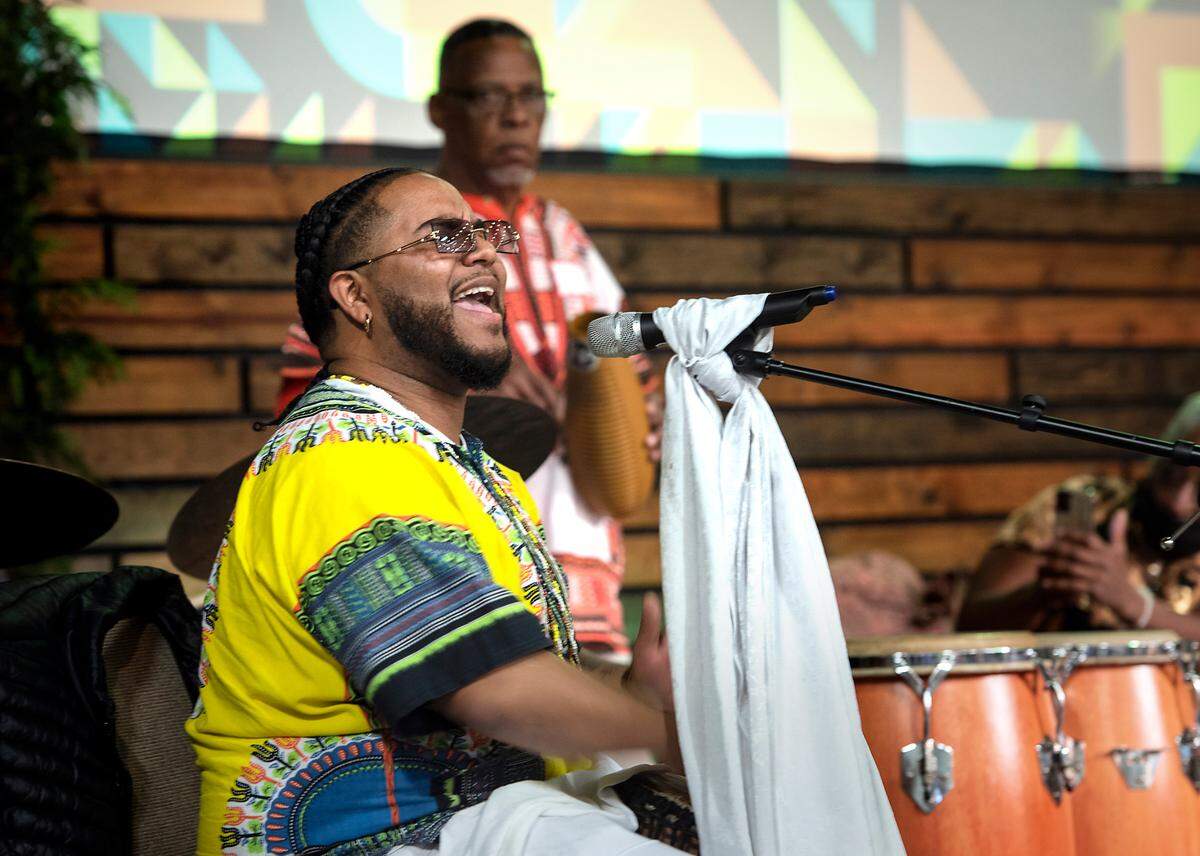Dontell Ramirez sings with the Ricky LaTour and the Cradle of Sound Drum Ensemble during the Modesto-Stanislaus NAACP Holiday Kwanzaa Social at Redeemer Modesto in Modesto, Calif., on Friday, Dec. 10, 2021.